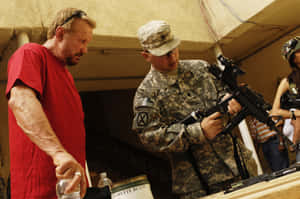 Diamond Dallas Page With A Soldier In Iraq Wallpaper