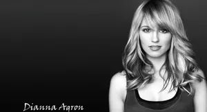 Dianna Agron Posing Elegantly In Blue Dress Wallpaper