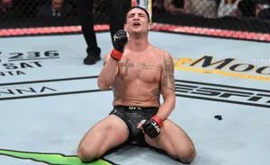 Diego Sanchez Kneeling In The Cage Wallpaper