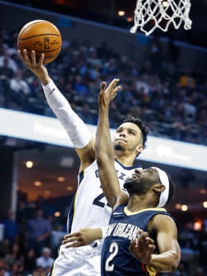 Dillon Brooks In Action During A Basketball Game Wallpaper