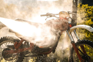 Dirt Bikein Action Sunlit Dust Wallpaper