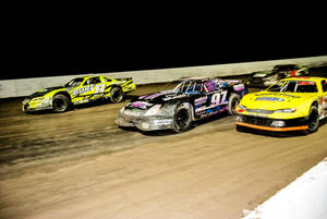 Dirt Racing Cars On A Dirt Track Wallpaper