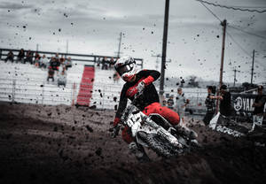 Dirtbike Kicking Dirt Up Wallpaper