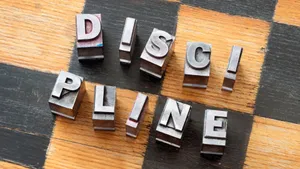 Discipline Stamped Letterson Checkerboard Wallpaper