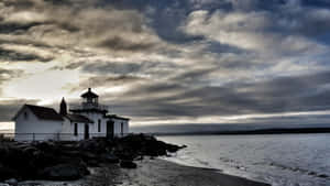 Discovery Park Lighthouseat Dusk Wallpaper