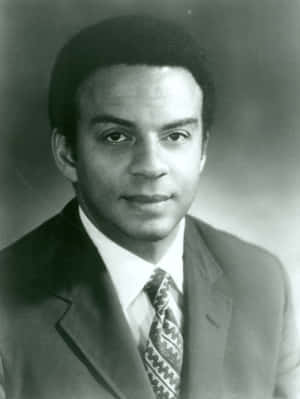 Distinguished Andrew Young In A Business Suit Wallpaper