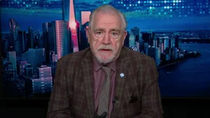 Distinguished Gentleman Against Cityscape Wallpaper