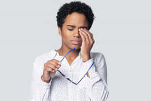 Distraught Individual Battling Nausea Wallpaper