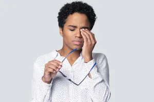 Distraught Individual Battling Nausea Wallpaper