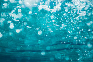 Dive Into The Bubbly Depths Of Water. Wallpaper