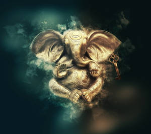 Divine Golden Statue Of Lord Ganesh Wallpaper