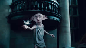 Dobby The House Elf Joyously Celebrates With Harry Potter Wallpaper