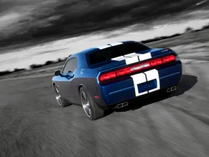 Dodge Challenger In An Asphalt Road Wallpaper