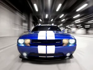Dodge Challenger Speeding In The Road Wallpaper