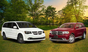 Dodge Grand Caravanand Durango Parked Outdoors Wallpaper