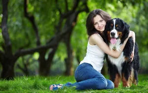 Dog And Girl In A Field Wallpaper