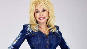 Dolly Parton Smilingin Denim Outfit Wallpaper