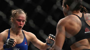 Dominant Ufc Champion Amanda Nunes During A Fight Wallpaper