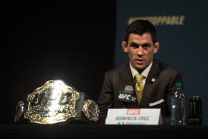 Dominick Cruz With Ufc Belt Wallpaper