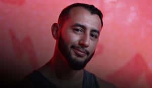 Dominick Reyes Portrait Red Background Wallpaper