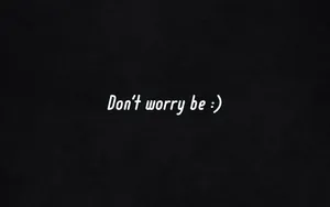 Don't Worry Be - A Black Background With White Text Wallpaper