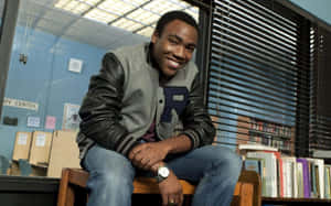 Donald Glover Smilingin Library Scene Wallpaper