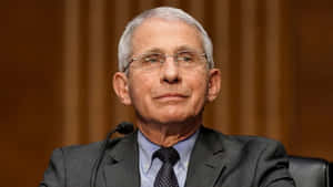 Dr. Anthony Fauci Delivering A Speech On Public Health Issues Wallpaper
