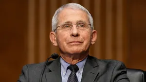 Dr. Anthony Fauci Delivering A Speech On Public Health Issues Wallpaper