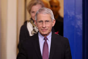 Dr. Anthony Fauci During A Press Conference Wallpaper