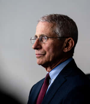 Dr. Anthony Fauci Making A Presentation Wallpaper