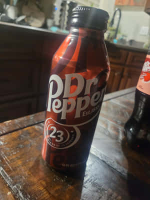 Dr Pepper Bottleon Wooden Table Wallpaper