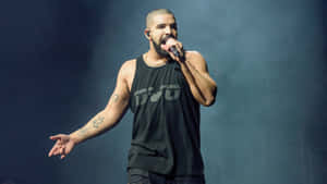 Drake Performs On Stage At A Concert Wallpaper