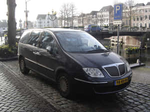 Dramatic View Of Lancia Phedra Under The Skyline. Wallpaper