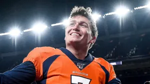 Drew Lock Smilingin Broncos Uniform Wallpaper