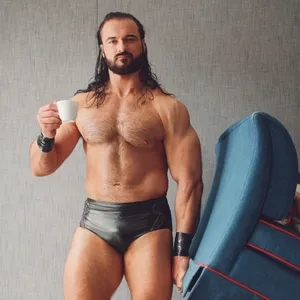 Drew Mcintyre Wrestler With Coffee Wallpaper