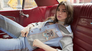 Dua Lipa In Red Car Wallpaper