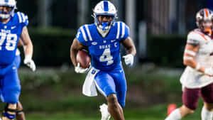 Duke Football Playerin Action Wallpaper