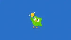Duolingo Owl Celebrates Success Wallpaper