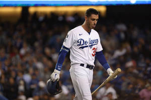 Dynamic Action Shot Of Cody Bellinger On The Field Wallpaper