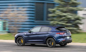 Dynamic Alfa Romeo Stelvio In Action Wallpaper