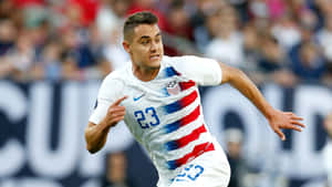 Dynamic American Soccer Player, Aaron Long In Action Wallpaper