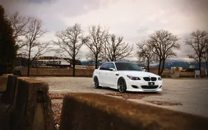 Dynamic Bmw M5 In Action On A Beautiful Open Road Wallpaper