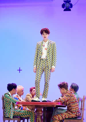 Dynamic Bts Mv Group Shot On Stylish Urban Stage Wallpaper