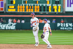 Dynamic College Baseball Game Moment Wallpaper