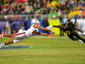 Dynamic College Football Action Wallpaper