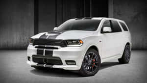 Dynamic Dodge Durango Against A Stunning Sunset Wallpaper