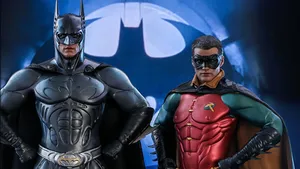 Dynamic Duo: Batman And Robin In Action Wallpaper