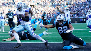 Dynamic Football Actionat Goal Line Wallpaper