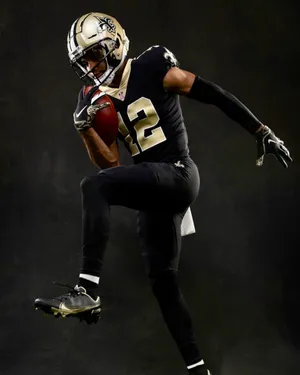 Dynamic Football Player Action Pose Wallpaper