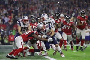 Dynamic Football Tackle Action Shot Wallpaper